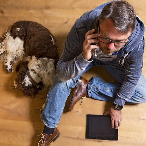 Man on phone with local dog nutritionist